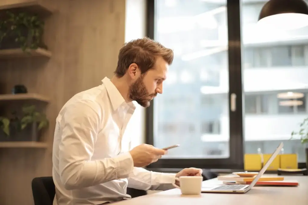 Businessman looking into a laptop screen