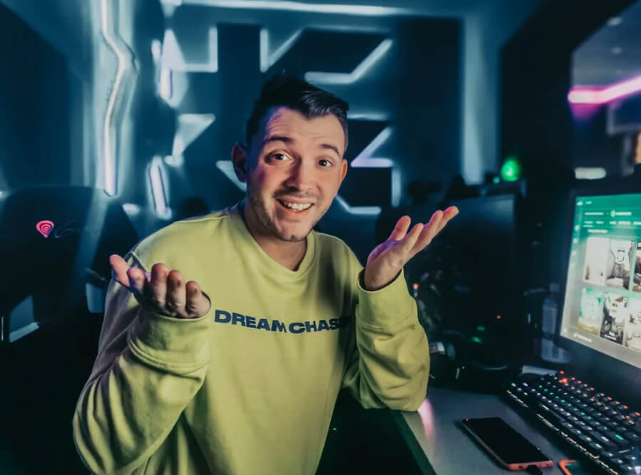 Website Developer in Roseville with shrug pose in colorful tech room